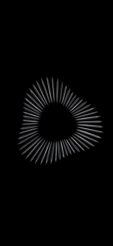 A reflective ring of metallic needles expands and contracts continuously.